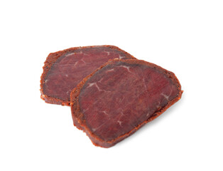 Delicious dry-cured beef basturma slices on white background