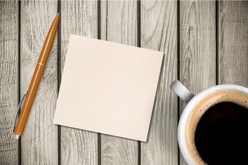 Paper with a cup of coffee, product or business review of the recent year