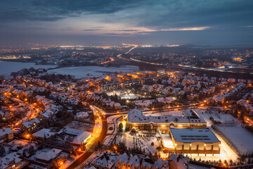 Aerial landscape of small village at dusk covered with fresh snow