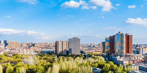 Ferris wheel and city skyline scenery in Qingcheng Park, Hohhot, Inner Mongolia, China © Govan