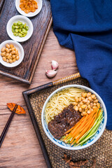 Beijing cuisine old Beijing fried sauce noodles placed on wooden table