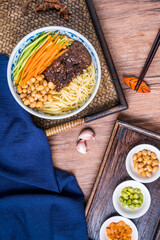 Beijing cuisine old Beijing fried sauce noodles placed on wooden table