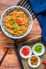 Wuhan gourmet hot dry noodles placed on wooden table 