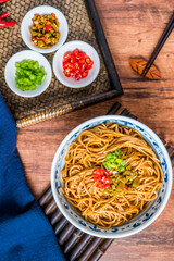 Wuhan gourmet hot dry noodles placed on wooden table 