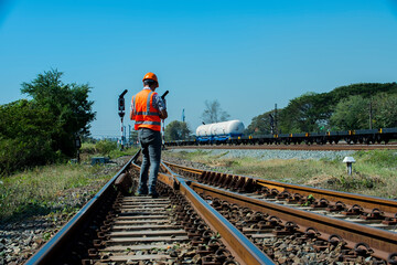 person on railway. engineer standing on railway inspection. construction worker on railways. Engineer work on railway. rail, engineer, Infrastructure