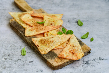  Home made ketogenic  Crispy nachos  tortilla chips with spicy red sauce. Mexican snack  for cinema.