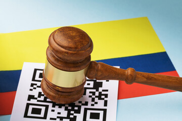 Judge gavel, barcode sheet and Colombian flag, the concept of administrative punishment for violation of the regime using QR codes in Colombia