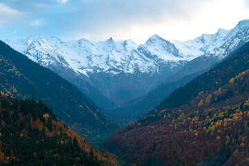 Beautiful mountain autumn landscape with colorful trees, impressive snow peaks. Picturesque landscapes of Svaneti, Georgia