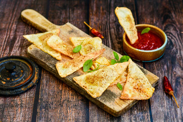  Home made ketogenic  Crispy nachos  tortilla chips with spicy red sauce. Mexican snack  for cinema.