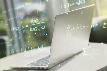 Double exposure of creative scientific formula concept on laptop background, research and development concept
