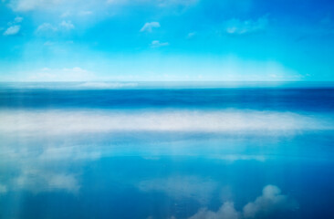 Fototapeta na wymiar Waves clouds and sky reflection along the Atlantic seashore and Outer Banks of North Carolina
