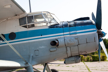 Old soviet aircraft biplane Antonov AN-2 parked on exhibition area in open air museum.