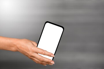 Mobile phone or cell phone being held showing the blank screen