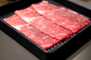 Premium beef thinly sliced for Japanese sukiyaki and shabu shabu.