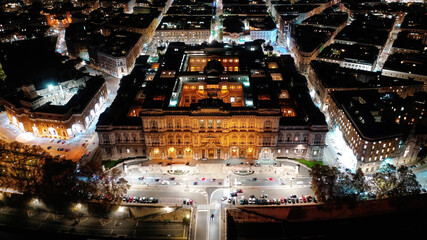 Aerial drone night shot from illuminated Cassation court Palace of justice, the highest supreme court of Italy next to famous piazza Cavour, Rome historic centre - obrazy, fototapety, plakaty