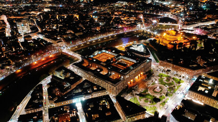 Aerial drone night shot from illuminated Cassation court Palace of justice, the highest supreme court of Italy next to famous piazza Cavour, Rome historic centre