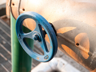 blue color manual valve handwheel, close up shot