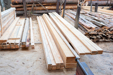 Wooden boards in the sawmill warehouse. Sawing wood