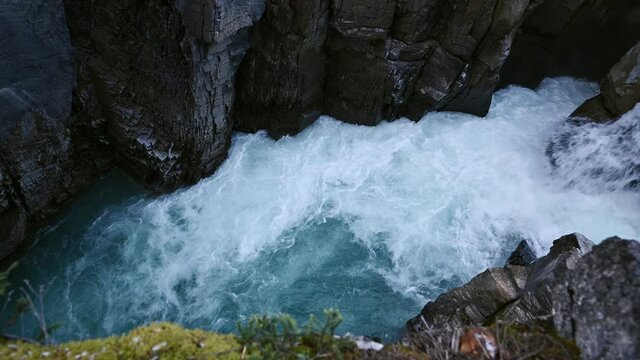Turquoise water rapids in canyon at Sunwapta Falls, Icefields Parkway