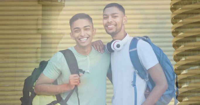 Animation of biracial male friends smiling over cityscape
