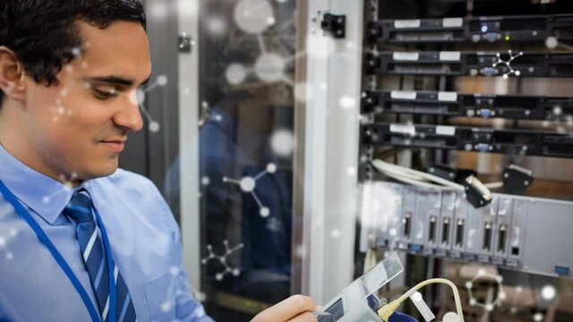 Animation of shapes moving over biracial male worker inspecting server room