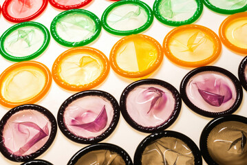 Obraz na płótnie Canvas Colorful condoms background.