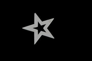White wooden star isolated on black background