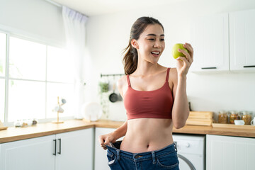 Asian beautiful woman feel happy after lose weight for health in house - obrazy, fototapety, plakaty