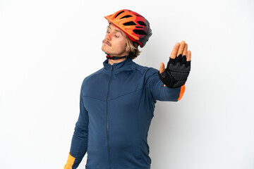 Young blonde cyclist man isolated on white background making stop gesture and disappointed - obrazy, fototapety, plakaty