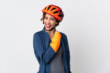 Young cyclist woman isolated on white background celebrating a victory