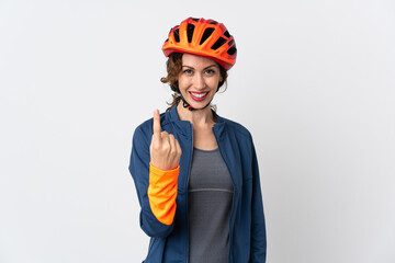 Young cyclist woman isolated on white background doing coming gesture