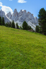 The Odle mountain group, Inside the Italian Dolomites, seen from Val di Funes, during a sunny day - August 2021.