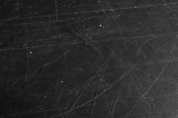 Obraz na płótnie Canvas Texture of scratched black surface as background, closeup