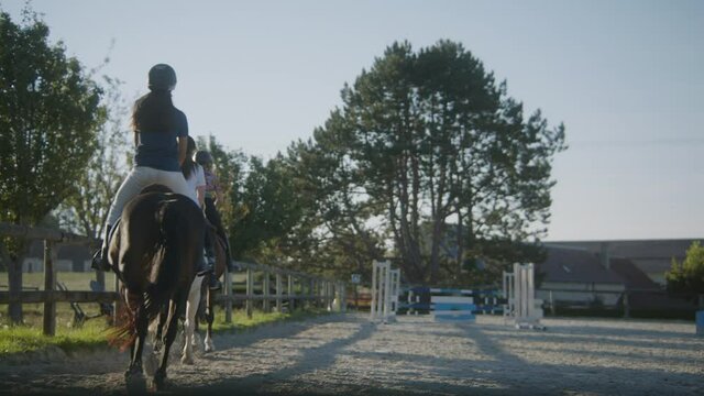 Riding horses at the equestrian center in France countryside.
