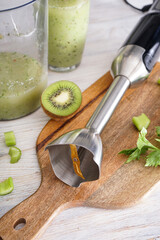 Hand blender for mixing organic raw fresh fruits for making vitamin diet smoothie, healthy food....