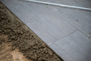 Fototapeta premium Tiled with granite tile on the floor in bathroom