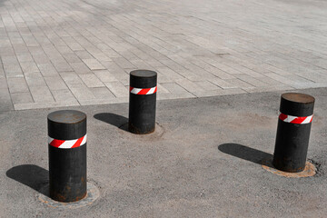 Bollards on the road, barrier posts, road barrier
