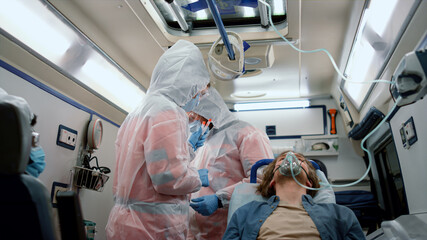 Doctors holding samples of coronavirus test. Patient transferring to hospital