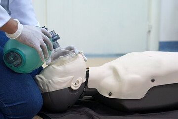 Using a Breathing bag (Ambu) by a student on a simulation dummy during basic life support with an...