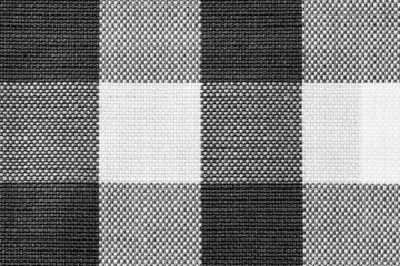 Close up of black and white checkered cotton fabric. Fabric texture background