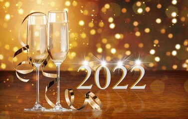 2022 New Year. Happy new year greeting card. Champagne glasses on glitter background