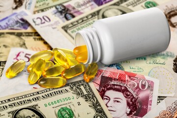 US dollars and oral drug against Covid-19. Concept of purchasing, buying or roll out tablets