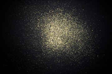 Fototapeta premium Old gold glitter on black background. Simple festive layout.