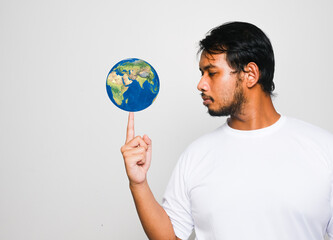 A picture of man putting the globe at its fingertip. World is in our hand concept