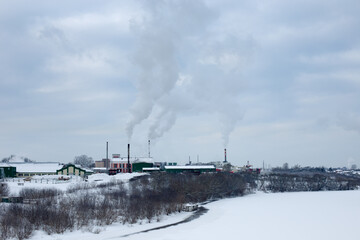 Industrial area of the city in winter, heat production