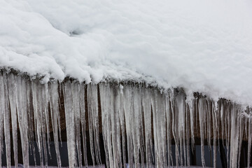 icicle on roof of the ice house in the winter