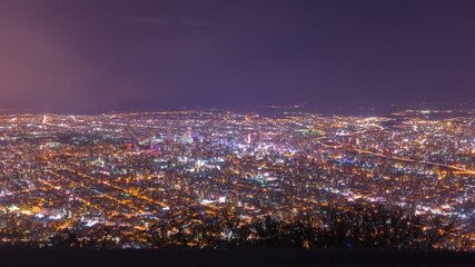 panorama of cityscape in the night view from Moiwa mountain, Sapporo in Kokkaido, Japan