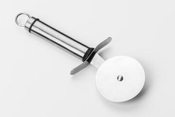 Beautiful steel knife for pizza on a white background