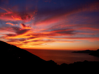 Dramatic sunset at the Calanche de Piana, UNESCO world heritage site. Corsica, France.