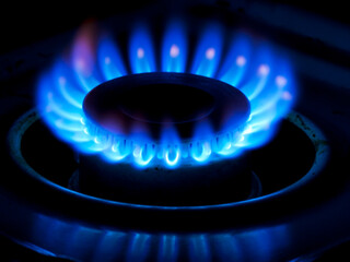 Close-up photo of a gas burner on.